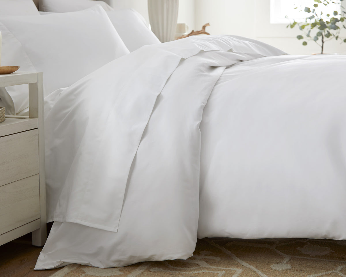 Close-up of pristine white Sateen cotton sheets with subtle sheen